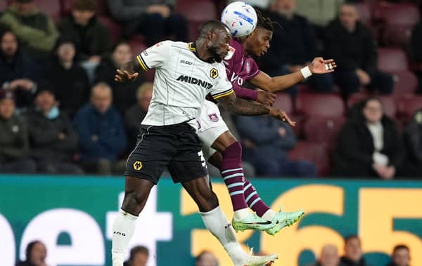 Wolves defender Ghislain Konan (left) battles with Burnley’s Largie Ramazani for the ball
