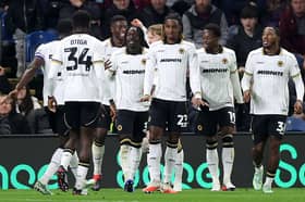 Wolves players celebrate after Tawanda Chirewa puts them 2-1 ahead at Burnley