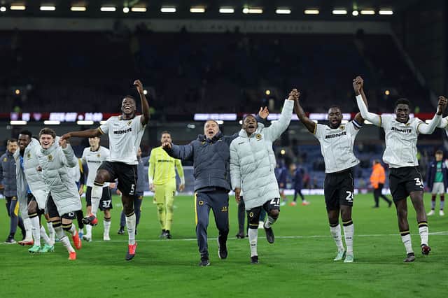 Wolves players celebrate their win at Burnley