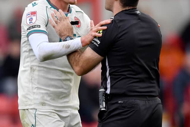 Isaac Moore appeals to the ref after Aaron Pressley's goal is disallowed.