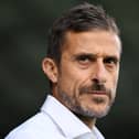Alessio Dionisi looks on