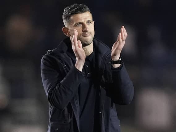John Mousinho applauds the fans