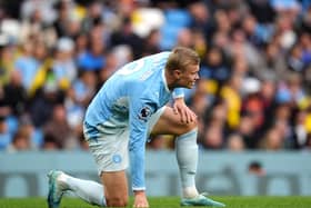 Manchester City’s Erling Haaland reacts to an injury