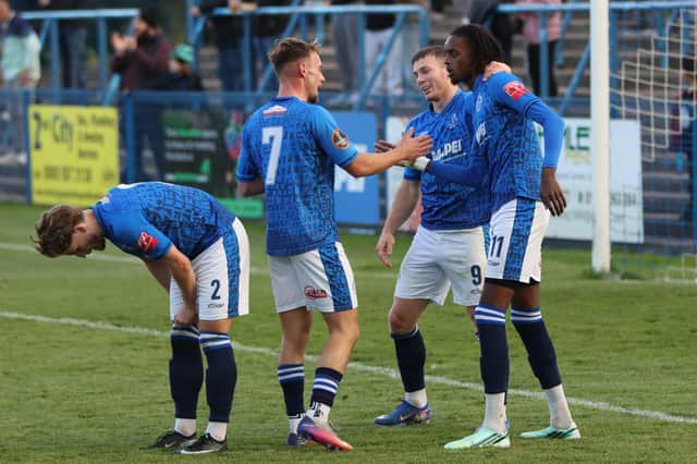 The goalscorer is mobbed by Halesowen Town team-mates against Hitchin