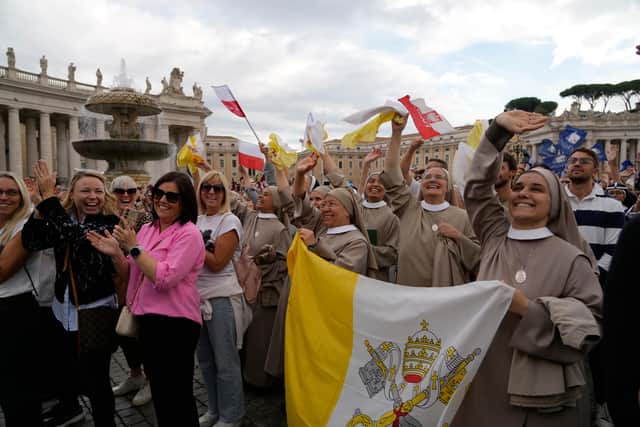 Faithful watch Pope Leo XIV appearing at the window of his study (Gregorio Borgia/AP)