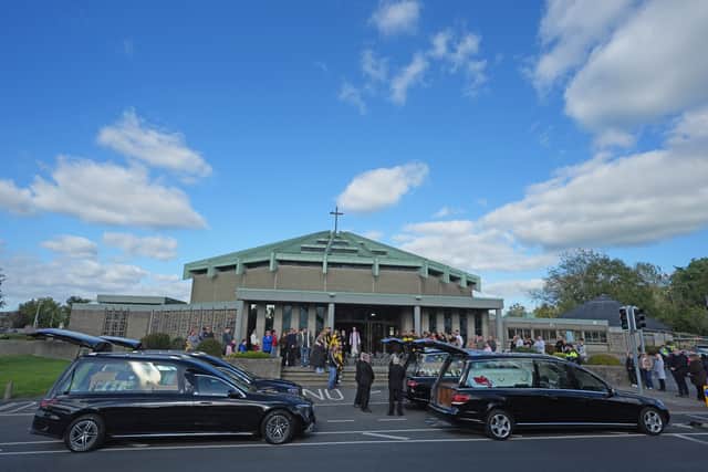 Four hearses carrying the coffins of Philip and Kim English and their sons, Jayden and Callum, arrive at the Sacred Heart Church Parish Centre (Brian Lawless/PA)