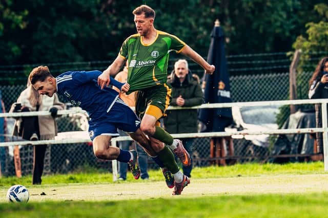 Lye Town's Alfie Didlock is brought down during the 6-5 thriller against AFC Wolverhampton City won by Lye.