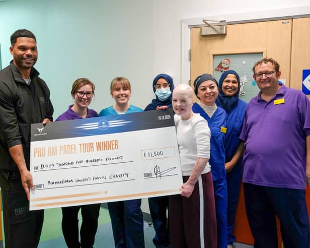 Joleon Lescott (far left) presenting £11,500 donation cheque, with patient Elizabeth Soffe (centre right, front) and Burns Centre clinical staff