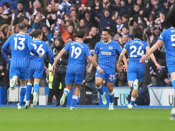 Brighton’s Diego Gomez (centre) celebrates scoring
