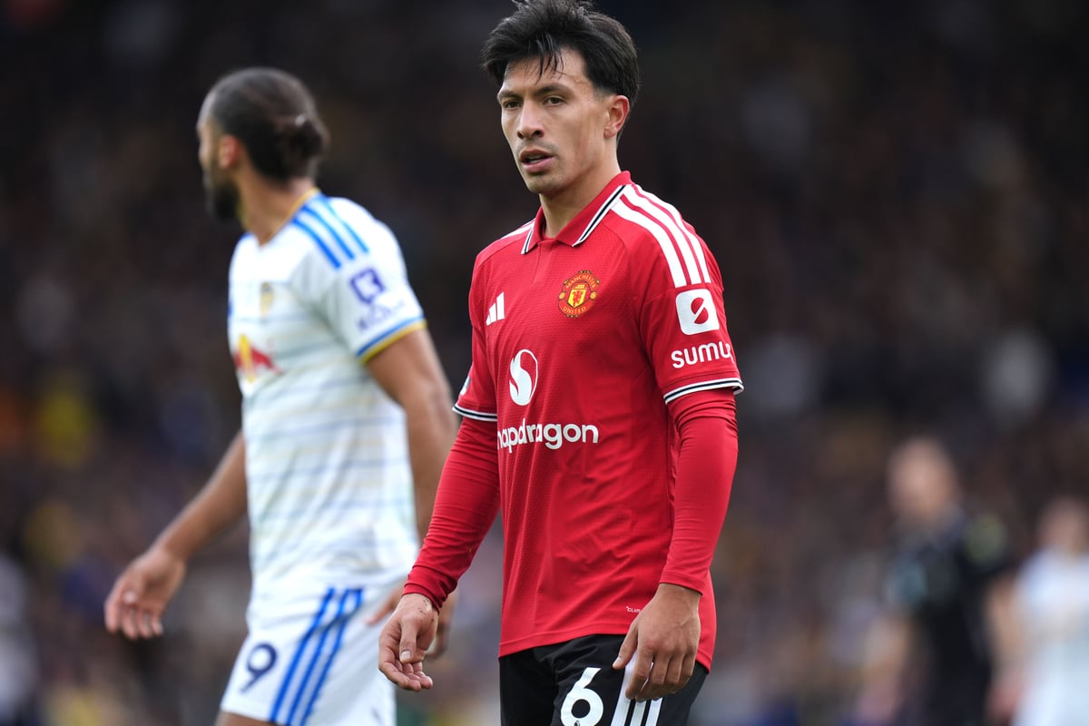 Lisandro Martinez receives support from Man Utd fans as Jason Wilcox watches on