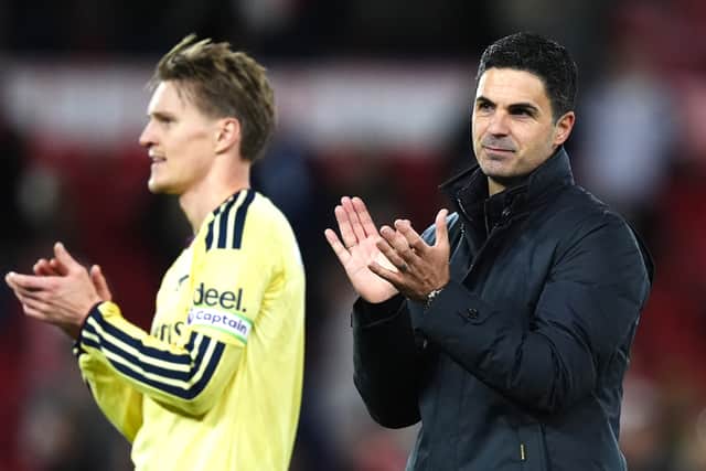 Arsenal manager Mikel Arteta (right) and Martin Odegaard applaud the fans (Mike Egerton/PA)