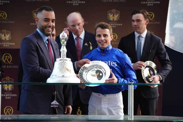 William Buick picks up his trophy (Jonathan Brady/PA)