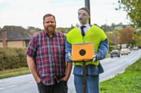 Tom Decker with knitted traffic officer in Fillongley, Warwickshire.