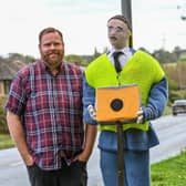 Tom Decker with knitted traffic officer in Fillongley, Warwickshire.
