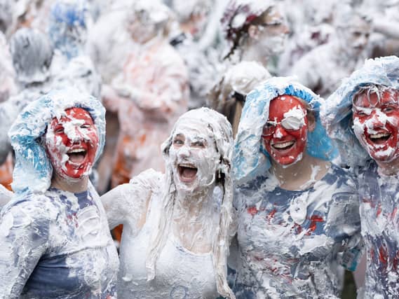 Students covered in shaving foam