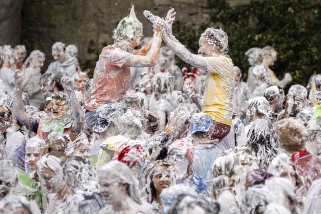Students taking part in the traditional Raisin Monday foam fight (Jane Barlow/PA)