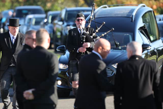 A piper led the cortege (Robert Perry/PA)