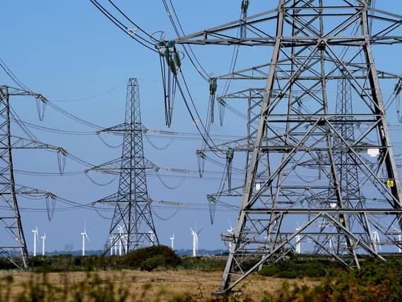 Electricity pylons run across Romney Marsh in Kent