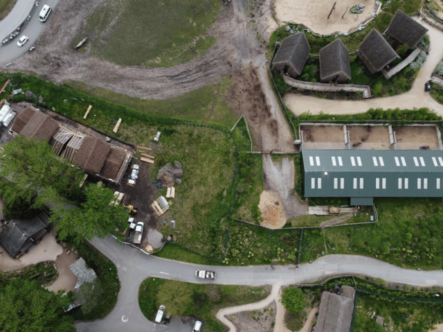 An aerial view of the site shows existing rhino lodges to the east (left), rhino house to the west (right) and main paddock to the south (top of image)