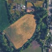 The site of a proposed four bed house on grassland in Crudgington