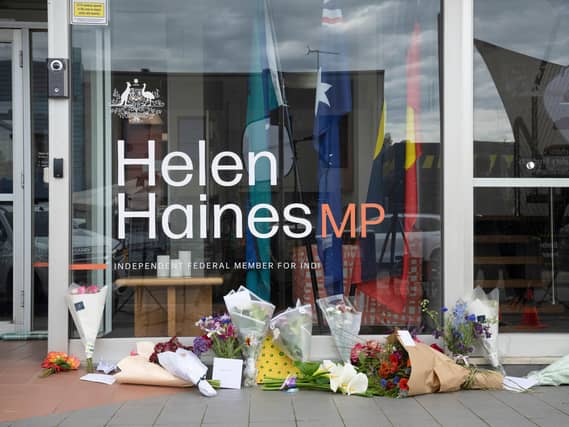 Tributes and flowers are placed outside the electoral office for independent member of parliament Helen Haines in Wangaratta