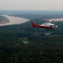 A helicopter from Brazil’s environmental agency flies over an area of the Amazon rainforest
