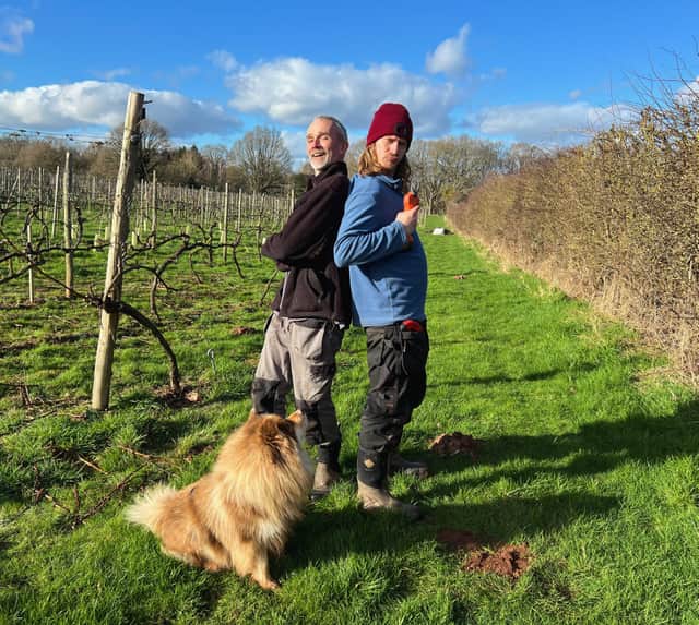 Tim Haywood and son Chris at Astley Vineyard with the family dog Otso