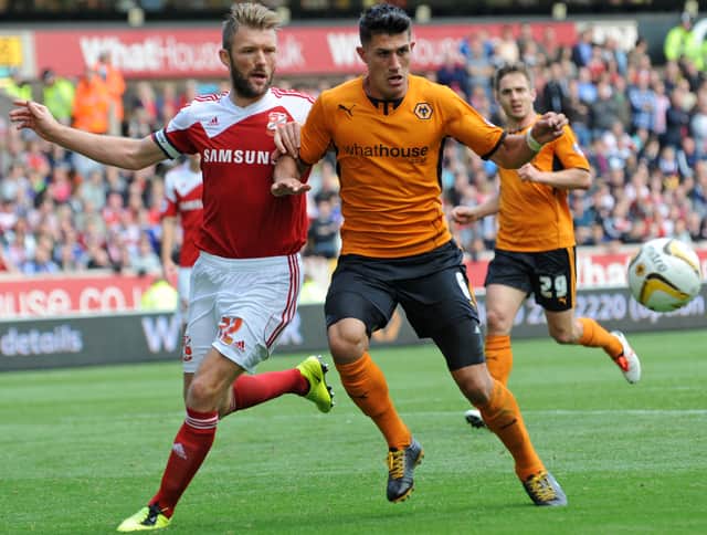 Having moved on, Danny Ward comes up against Wolves centre-back Danny Batth while with Swindon