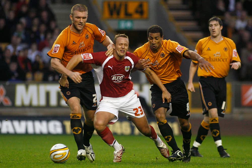 Darren Ward in Wolves action alongside Karl Henry