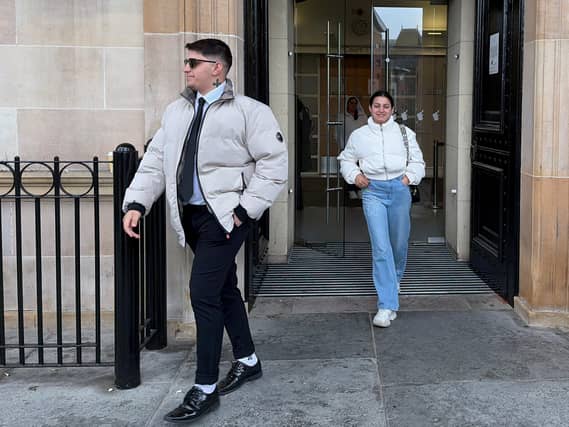Ilia and Nadjedzha Belova exiting a building