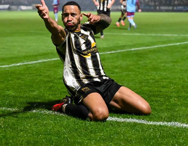 Darrhyl Mason celebrates putting Stafford Rangers 2-0 ahead against Gateshead