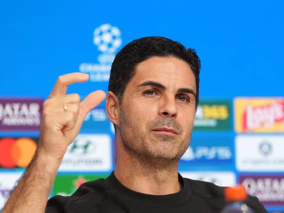 Mikel Arteta holds his thumb and forefinger a short distance apart during his pre-match press conference