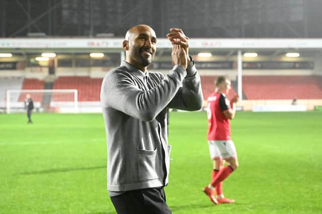 Walsall head coach Lee Grant celebrates their victory over Oldham at full-time.