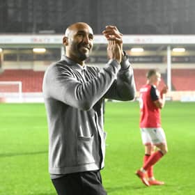 Walsall head coach Lee Grant celebrates their victory over Oldham at full-time.