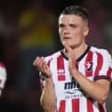 Freddie Willcox applauds the Cheltenham fans