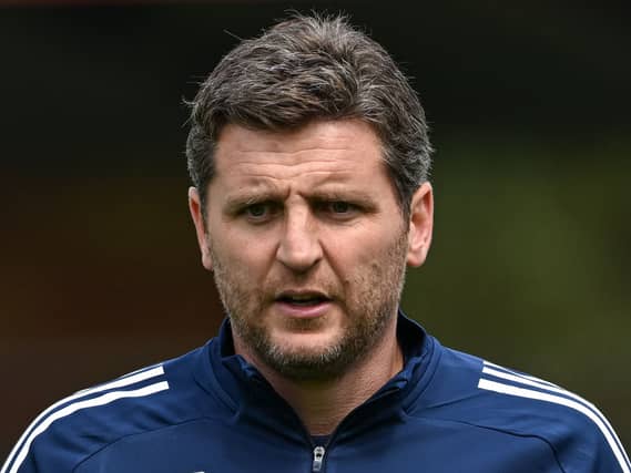 Alex Bruce looks on