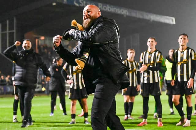 Stafford Rangers boss Graham Deakin celebrates after the famous FA Cup win. Pic: Pete Wideman