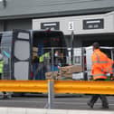 View of workers loading vans at an Amazon warehouse