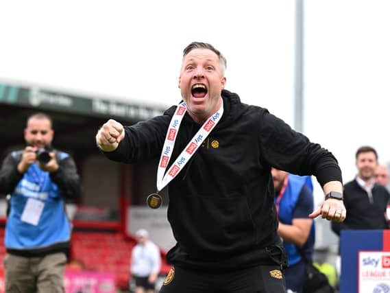 Cambridge manager Neil Harris celebrates