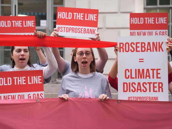 Fossil Free London protesters holding banners