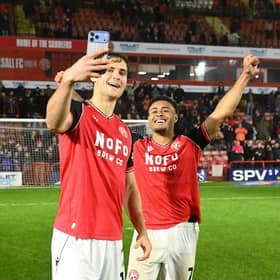 Walsall goal scorers Aaron Pressley (left) and Tai Sodje (right) celebrate after their win over Oldham.