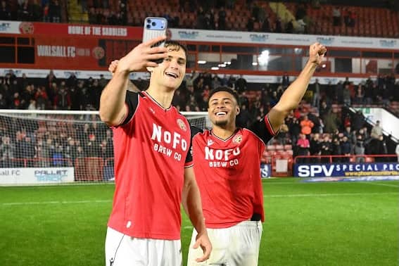 Walsall goal scorers Aaron Pressley (left) and Tai Sodje (right) celebrate after their win over Oldham.