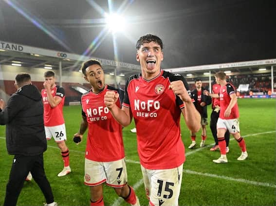 Isaac Moore (right) and Tai Sodje (left) celebrate after Walsall returned to winning ways in League Two - following three successive draws.