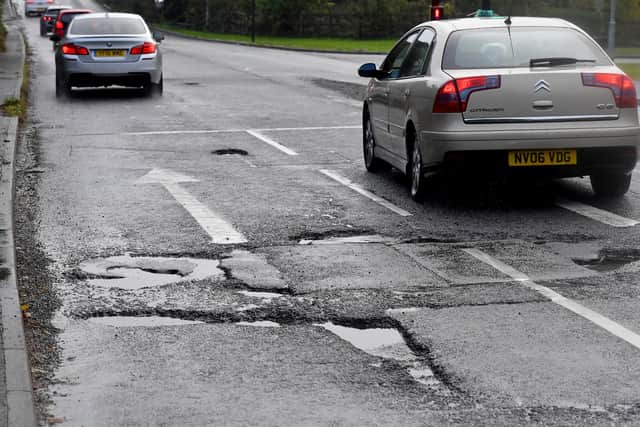 Bad potholes at the junction of Gospel End Road and Brick Kiln Way, near Baggeridge Village are causing problems for drivers.
Tim Thursfield/Iconic Media Group