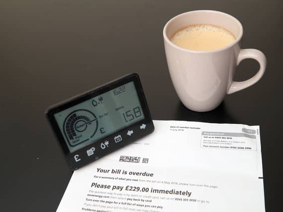 A smart meter next to an energy bill