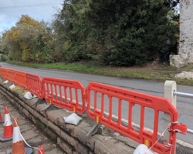 The damaged railings outside the Punch Bowl