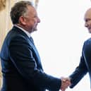 Russian President Vladimir Putin, right, greets US envoy Steve Witkoff