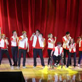 Glee Live Tour cast performing on stage