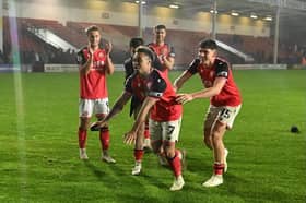 In-form Tai Sodje celebrates Walsall's latest victory with his teammates.