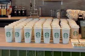 The first 100 customers to come through the doors following a ribbon cutting ceremony were given a free reusable cup.